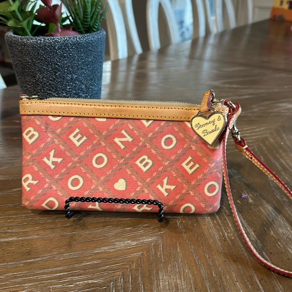 Dooney & Bourke Handbags - Dooney and Bourke wristlet RARE white heart charm